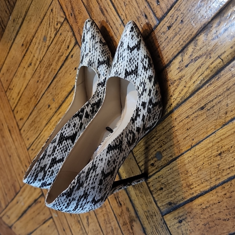 Nine West leather snakeskin looking heels man-made.